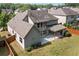 Aerial shot of home's back exterior featuring large windows, and a covered patio area at 231 Haney Rd, Woodstock, GA 30188