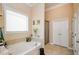 Relaxing bathroom with a large garden tub and separate shower at 231 Haney Rd, Woodstock, GA 30188