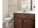 Cozy powder room with vanity and toilet at 231 Haney Rd, Woodstock, GA 30188
