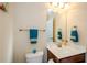 Small bathroom with single vanity and toilet at 231 Haney Rd, Woodstock, GA 30188