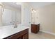 Bathroom featuring double sinks, tile floors, and vanity with dark wood cabinets at 231 Haney Rd, Woodstock, GA 30188