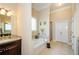 Bathroom with granite vanity, soaking tub, and walk-in shower at 231 Haney Rd, Woodstock, GA 30188