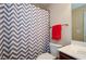 Clean bathroom with a chevron shower curtain and updated vanity at 231 Haney Rd, Woodstock, GA 30188