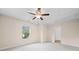 Bedroom with a ceiling fan and large window to provide natural light at 231 Haney Rd, Woodstock, GA 30188