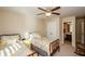 Bright bedroom with two twin beds, ceiling fan, and access to a private bathroom at 231 Haney Rd, Woodstock, GA 30188