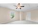 Comfortable bedroom with a ceiling fan and a window offering natural light at 231 Haney Rd, Woodstock, GA 30188