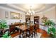 Bright dining room features a wood table, chandelier, and hardwood floors at 231 Haney Rd, Woodstock, GA 30188