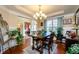 Spacious dining area with hardwood floors and a view into the living room at 231 Haney Rd, Woodstock, GA 30188