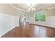 Inviting dining area with hardwood floors, wainscoting, and bright natural light at 231 Haney Rd, Woodstock, GA 30188