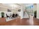 Grand foyer and dining room featuring hardwood floors, wainscoting, chandelier, and staircase at 231 Haney Rd, Woodstock, GA 30188