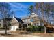 Two-story brick home with a two-car garage and nicely landscaped yard at 231 Haney Rd, Woodstock, GA 30188