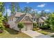 Charming two-story home with a well-maintained lawn and a two-car garage at 231 Haney Rd, Woodstock, GA 30188