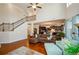 Two-story Gathering room with hardwood floors, a fireplace, and a view of the kitchen and staircase at 231 Haney Rd, Woodstock, GA 30188