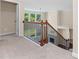 Upstairs landing with stairway overlooking the Gathering room and backyard at 231 Haney Rd, Woodstock, GA 30188