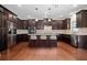 Gourmet kitchen featuring custom cabinets, stainless steel appliances, and a large kitchen island at 231 Haney Rd, Woodstock, GA 30188