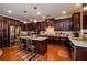 Kitchen features island with granite countertop and stainless steel appliances at 231 Haney Rd, Woodstock, GA 30188