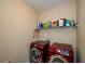 Laundry room with shelving and side-by-side washer and dryer at 231 Haney Rd, Woodstock, GA 30188