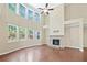Bright open living area with stone fireplace and view of backyard at 231 Haney Rd, Woodstock, GA 30188