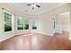Sunlit living area showcases large windows and warm hardwood flooring at 231 Haney Rd, Woodstock, GA 30188