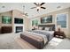 Spacious main bedroom with vaulted ceilings, fireplace, television, and large windows at 231 Haney Rd, Woodstock, GA 30188