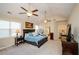 Spacious main bedroom with high ceilings, two ceiling fans, and access to the bathroom at 231 Haney Rd, Woodstock, GA 30188