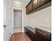 Mudroom with dark cabinets, granite countertops, and wood flooring at 231 Haney Rd, Woodstock, GA 30188