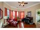 Home office with hardwood floors, built-in shelving, and window seating at 231 Haney Rd, Woodstock, GA 30188