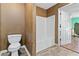 Small bathroom with a shower/tub combo and patterned wallpaper at 337 N Clayton St, Lawrenceville, GA 30046