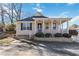 Charming house exterior with a covered porch and landscaping at 337 N Clayton St, Lawrenceville, GA 30046