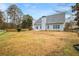 Large backyard with a fenced-in area and mature trees at 780 Treadstone Ct, Suwanee, GA 30024