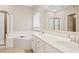 Bathroom with double vanity, soaking tub, and separate shower at 780 Treadstone Ct, Suwanee, GA 30024