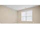 Bright bedroom with window and neutral walls at 780 Treadstone Ct, Suwanee, GA 30024