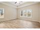 Spacious bedroom with hardwood floors and large windows at 780 Treadstone Ct, Suwanee, GA 30024