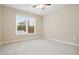 Spacious bedroom with large window and ceiling fan at 780 Treadstone Ct, Suwanee, GA 30024