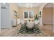 Dining room staged with table, chairs, and area rug at 780 Treadstone Ct, Suwanee, GA 30024