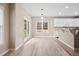 Bright dining room with hardwood floors and access to the backyard at 780 Treadstone Ct, Suwanee, GA 30024