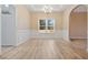 Formal dining room with wainscoting and hardwood floors at 780 Treadstone Ct, Suwanee, GA 30024