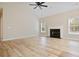 Spacious living room with fireplace and hardwood floors at 780 Treadstone Ct, Suwanee, GA 30024