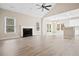 Open living room featuring a fireplace and hardwood floors at 780 Treadstone Ct, Suwanee, GA 30024