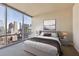 Bedroom with city views and modern decor at 20 10Th Nw St # 2104, Atlanta, GA 30309