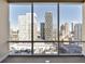 Bright bedroom with floor to ceiling windows and city views at 20 10Th Nw St # 2104, Atlanta, GA 30309