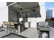 Outdoor kitchen with grill, bar seating, and sink at 20 10Th Nw St # 2104, Atlanta, GA 30309