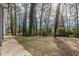 Private backyard with wooded area and a fence at 1707 Boulderview Se Dr, Atlanta, GA 30316