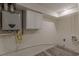Unfinished basement with laundry hookups and updated water heater at 1707 Boulderview Se Dr, Atlanta, GA 30316
