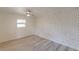 Bedroom with white painted brick wall and laminate wood floor at 1707 Boulderview Se Dr, Atlanta, GA 30316