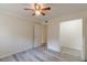 Well-lit bedroom with ceiling fan and adjacent closet at 1707 Boulderview Se Dr, Atlanta, GA 30316