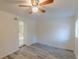 Bright bedroom with ceiling fan and wood-look flooring at 1707 Boulderview Se Dr, Atlanta, GA 30316