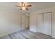 Bright bedroom with ceiling fan and double-door closet at 1707 Boulderview Se Dr, Atlanta, GA 30316