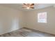Simple bedroom with ceiling fan and large window at 1707 Boulderview Se Dr, Atlanta, GA 30316