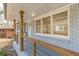 Modern wooden railing and light-blue front door enhance this home's curb appeal at 1707 Boulderview Se Dr, Atlanta, GA 30316